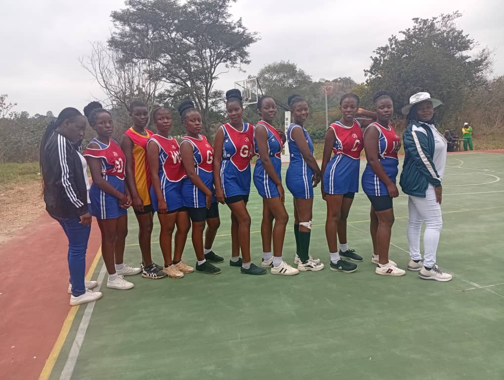 The school's netball team posing for a photo.